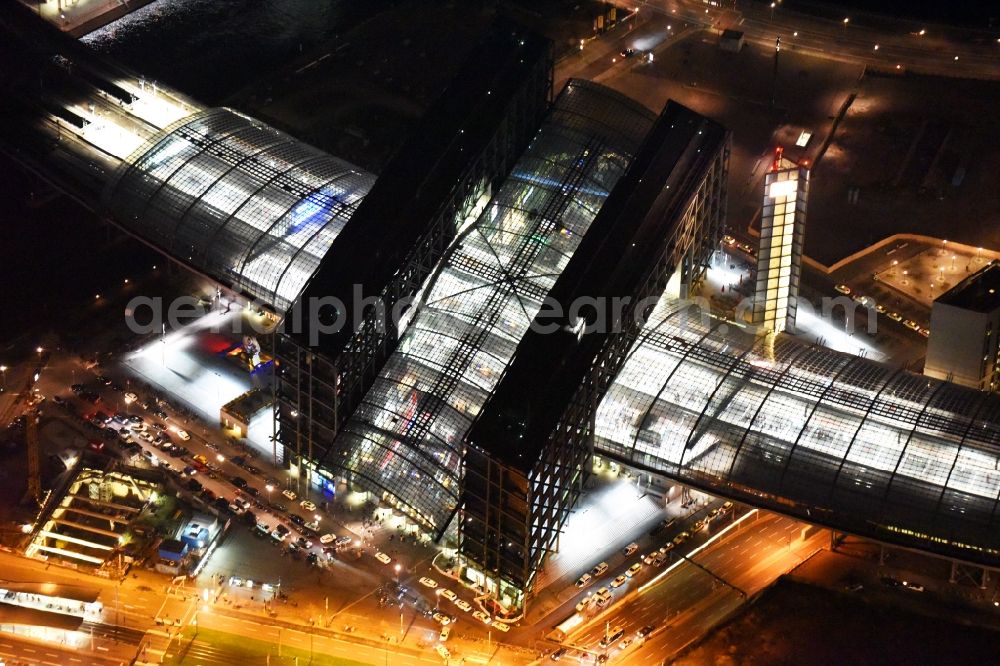 Aerial image at night Berlin - Night view of track progress and building of the main station of the railway in Berlin in Germany