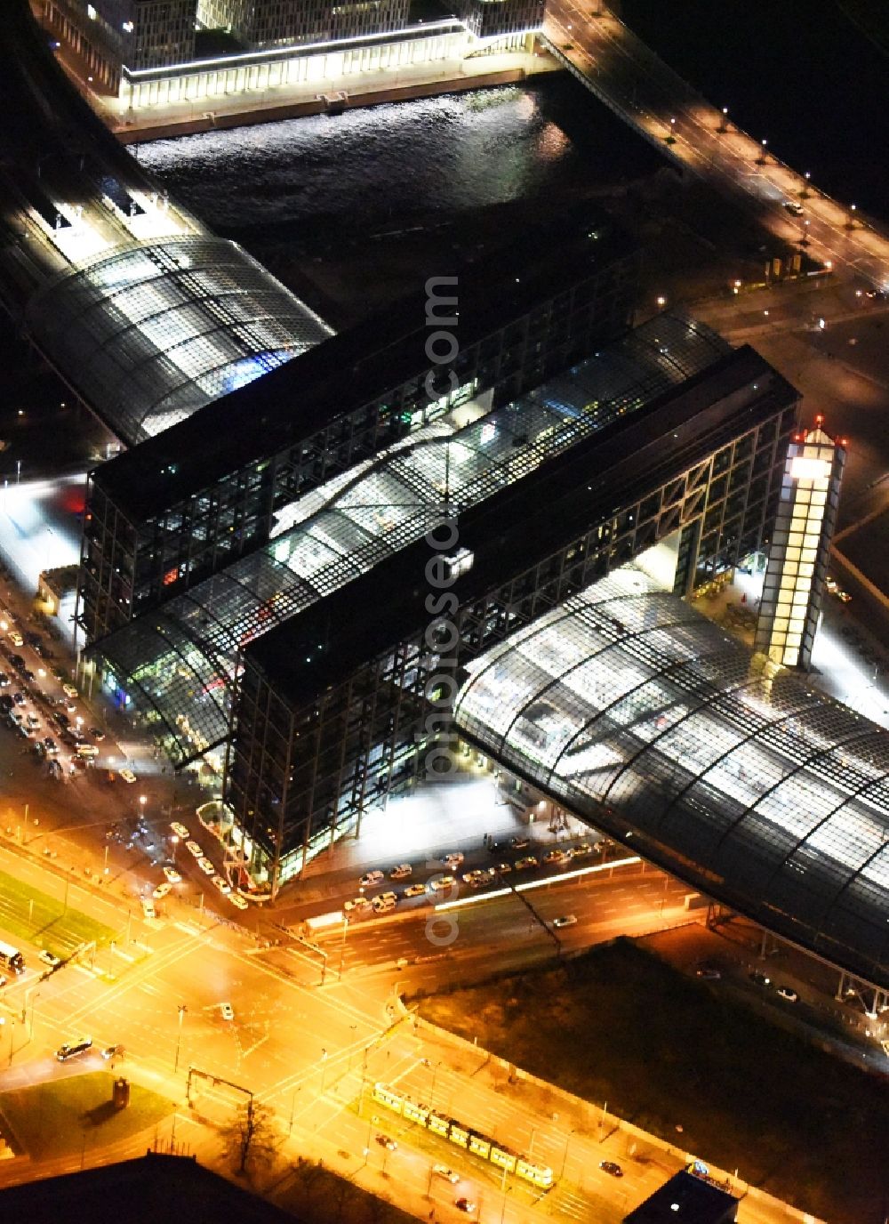 Aerial photograph at night Berlin - Night view of track progress and building of the main station of the railway in Berlin in Germany