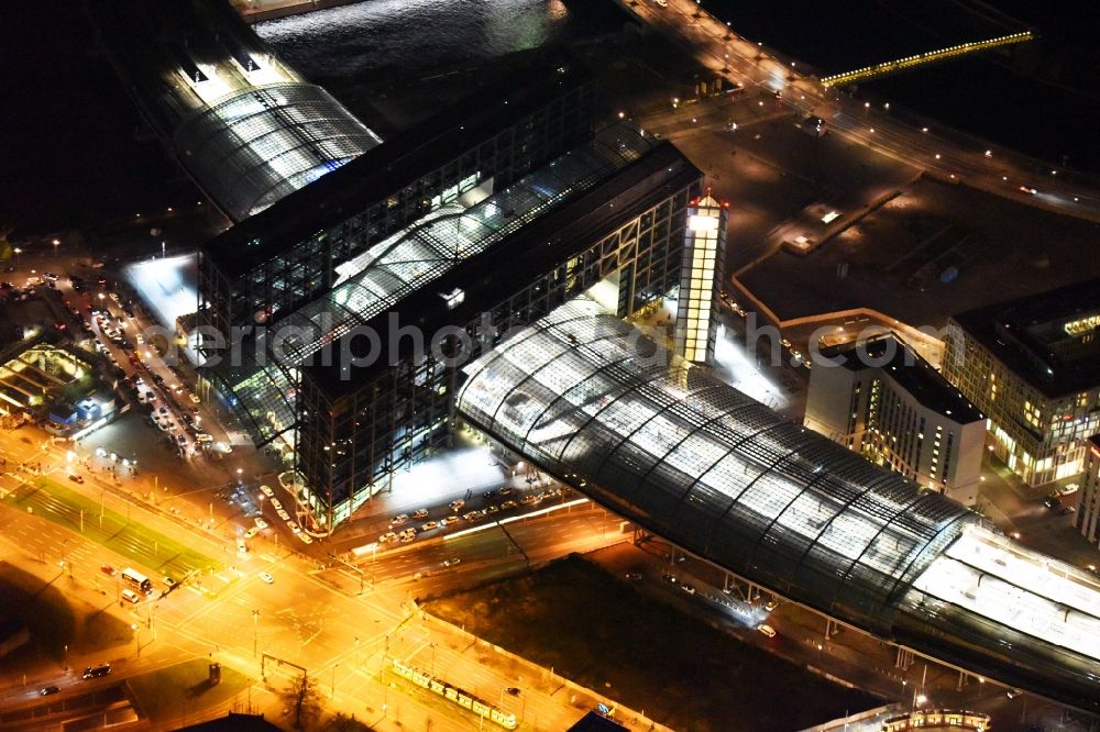 Aerial image at night Berlin - Night view of track progress and building of the main station of the railway in Berlin in Germany