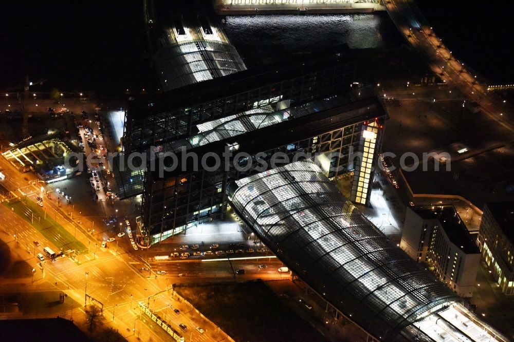 Berlin at night from the bird perspective: Night view of track progress and building of the main station of the railway in Berlin in Germany