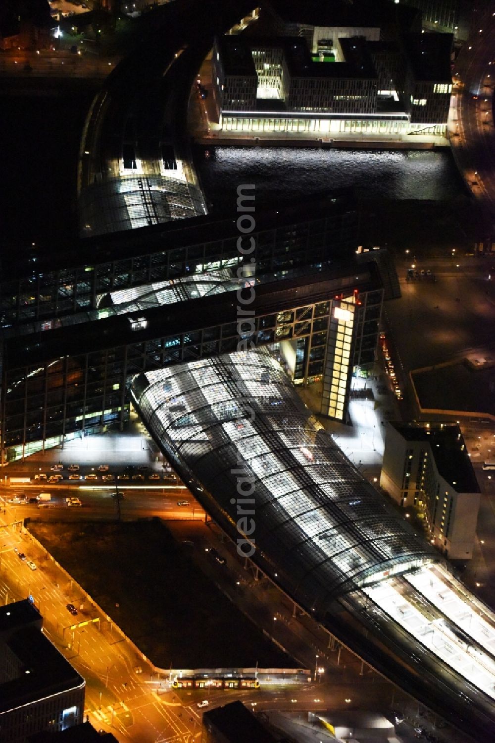 Aerial photograph at night Berlin - Night view of track progress and building of the main station of the railway in Berlin in Germany