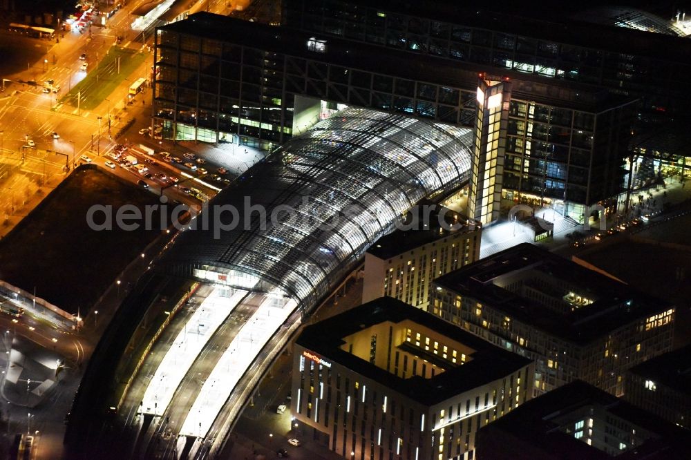 Berlin at night from the bird perspective: Night view of track progress and building of the main station of the railway in Berlin in Germany