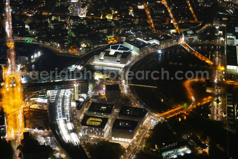 Aerial image at night Berlin - Night lighting Track progress and building of the main station of the railway in Berlin, Germany