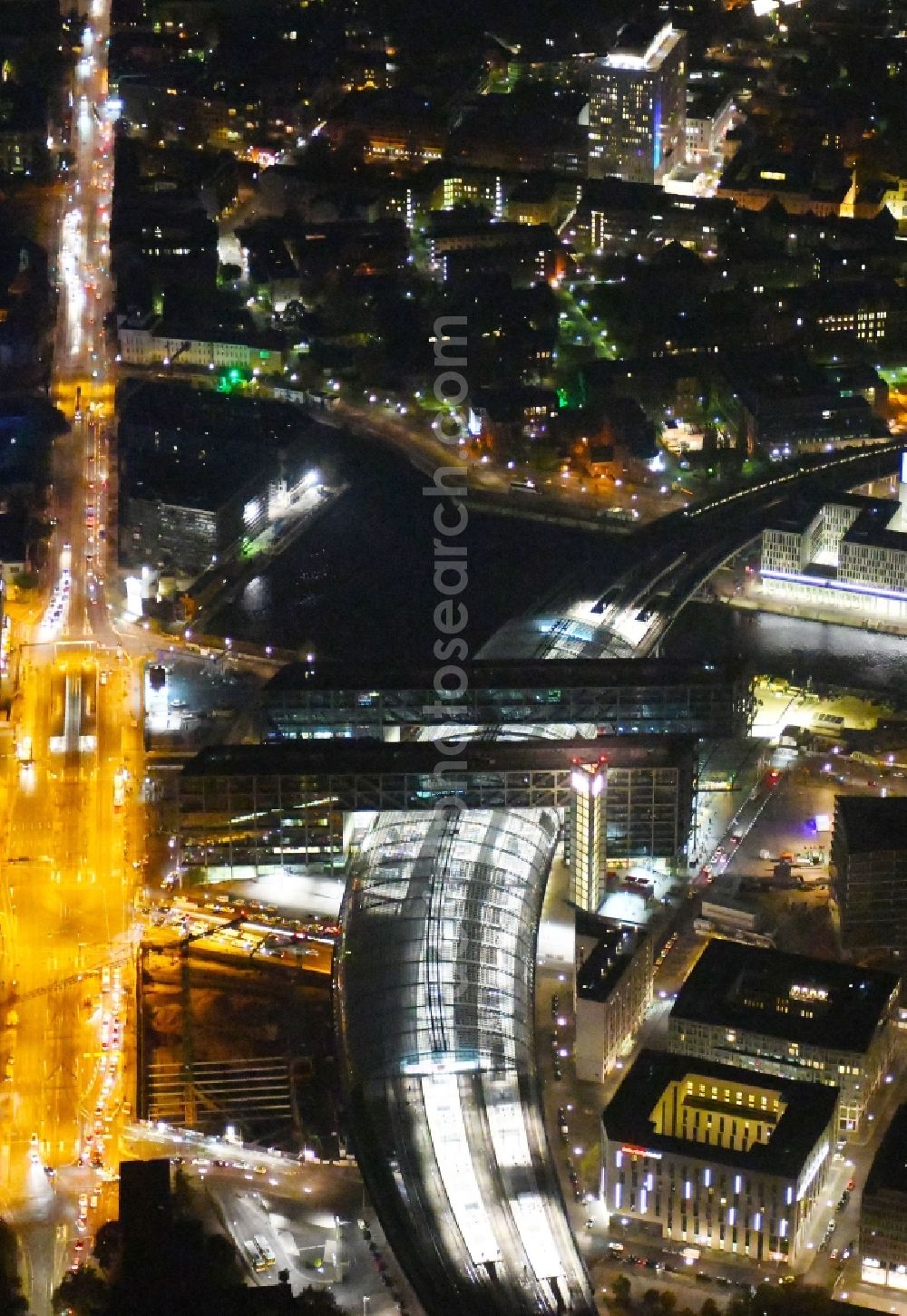 Aerial image at night Berlin - Night lighting Track progress and building of the main station of the railway in Berlin, Germany