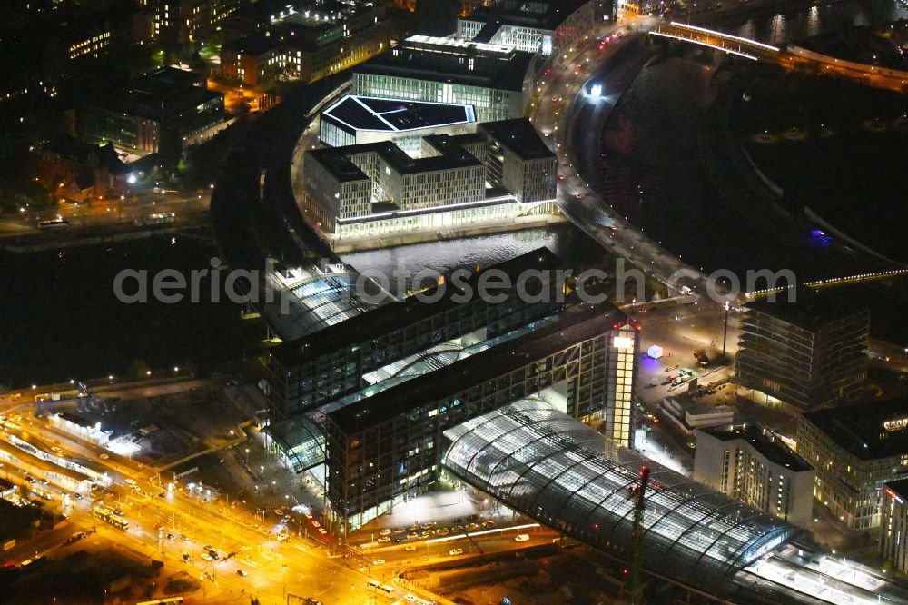 Berlin at night from the bird perspective: Night lighting Track progress and building of the main station of the railway in Berlin, Germany