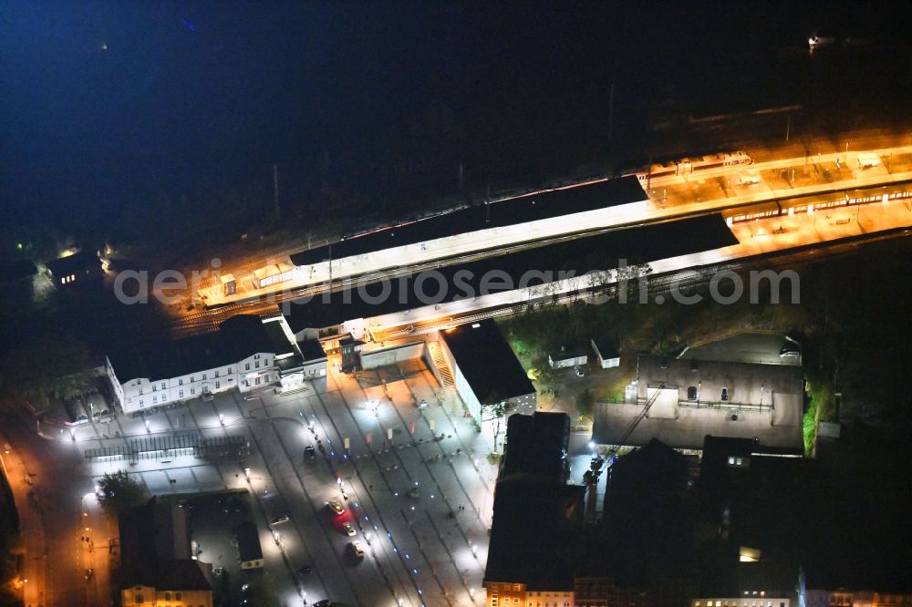 Bernau at night from above - Night lighting Track progress and building of the main station of the railway in Bernau in the state Brandenburg, Germany