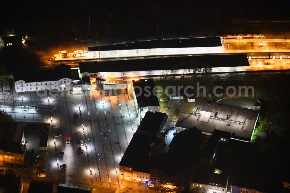 Bernau at night from the bird perspective: Night lighting Track progress and building of the main station of the railway in Bernau in the state Brandenburg, Germany