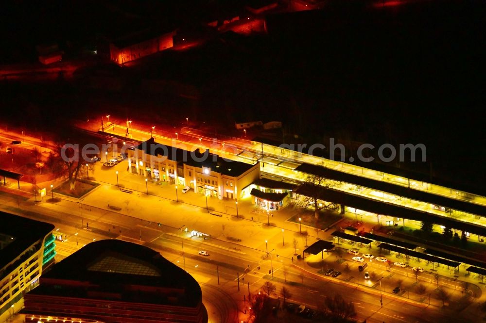 Aerial image at night Brandenburg an der Havel - Night lighting track progress and building of the main station of the railway in Brandenburg an der Havel in the state Brandenburg, Germany