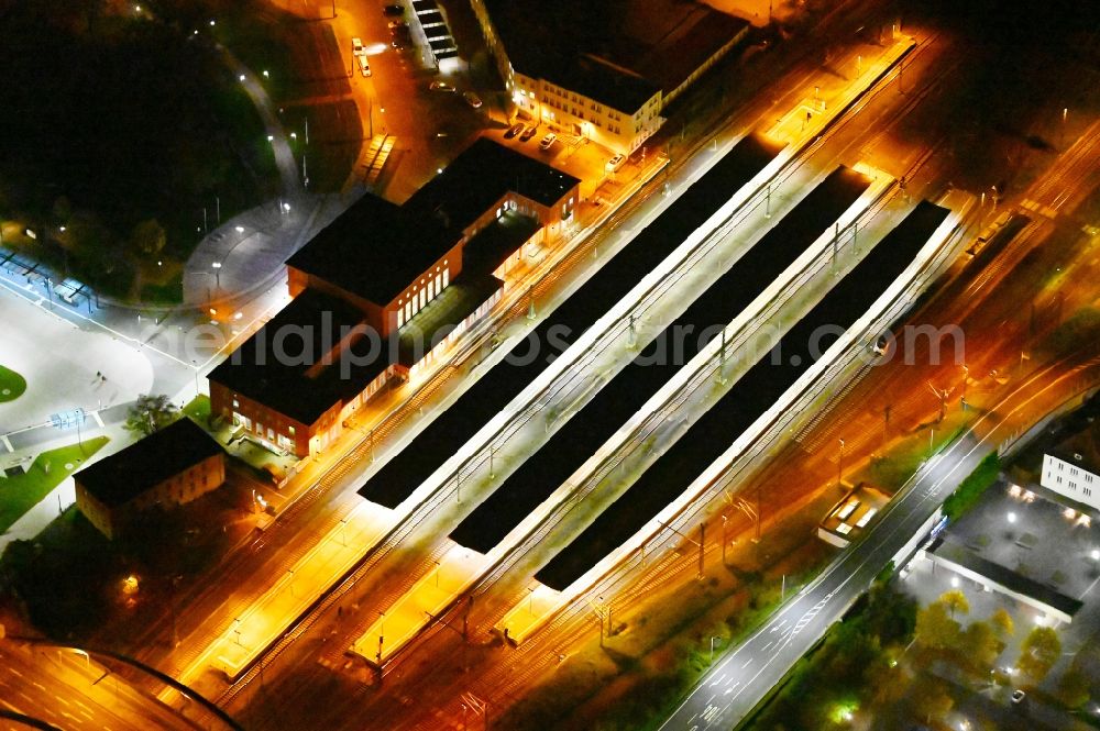 Aerial image at night Dessau - Night lighting track progress and building of the main station of the railway in Dessau-Rosslau in the state Saxony-Anhalt