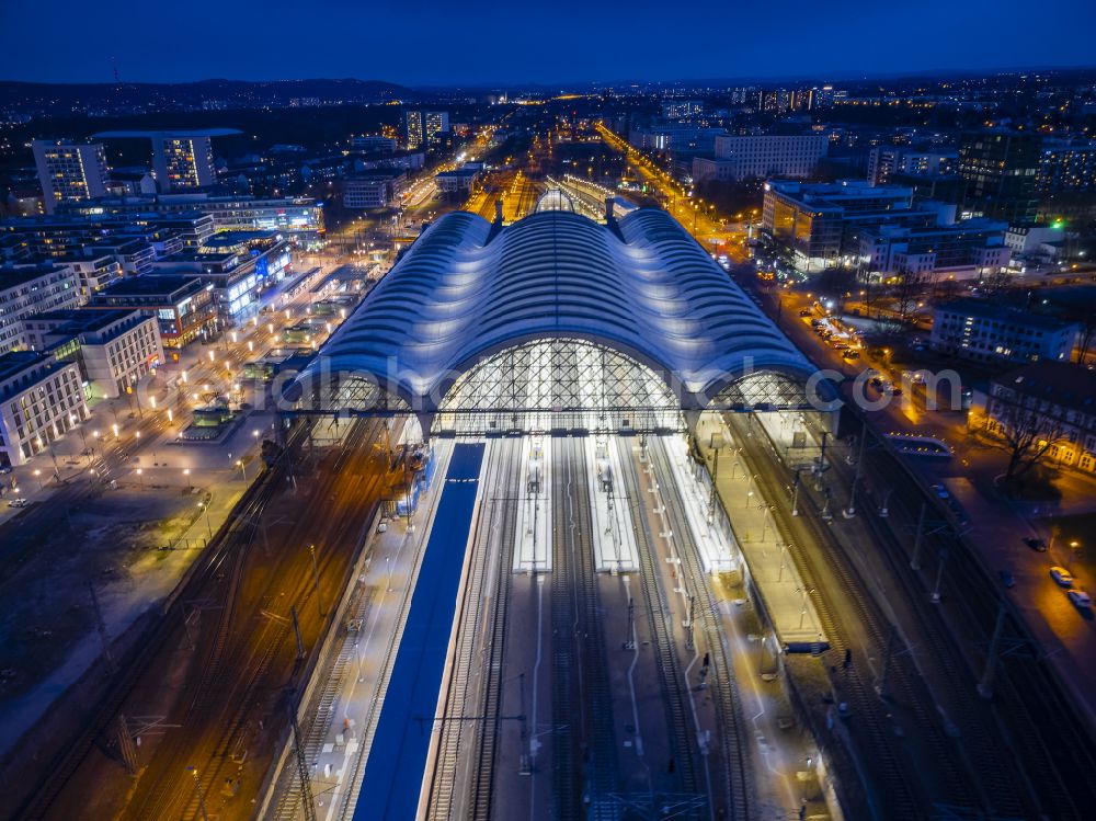 Aerial image at night Dresden - Night lighting track progress and building of the main station of the railway in Dresden in the state Saxony, Germany