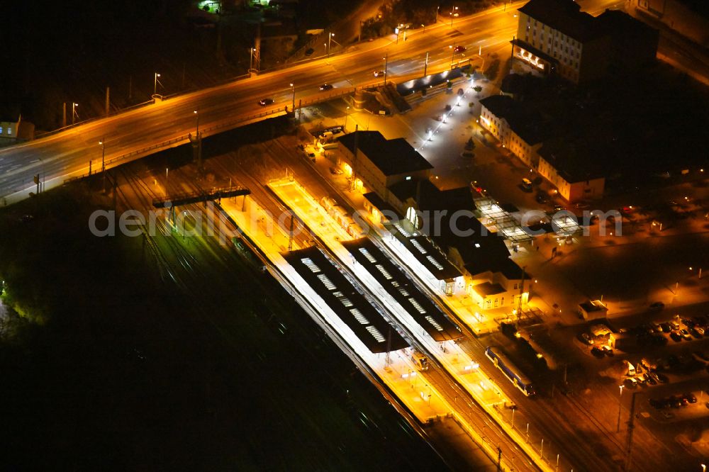 Aerial photograph at night Eberswalde - Night lighting Track progress and building of the main station of the railway on street Bahnhofsring in Eberswalde in the state Brandenburg, Germany