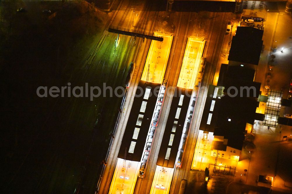 Aerial image at night Eberswalde - Night lighting Track progress and building of the main station of the railway on street Bahnhofsring in Eberswalde in the state Brandenburg, Germany