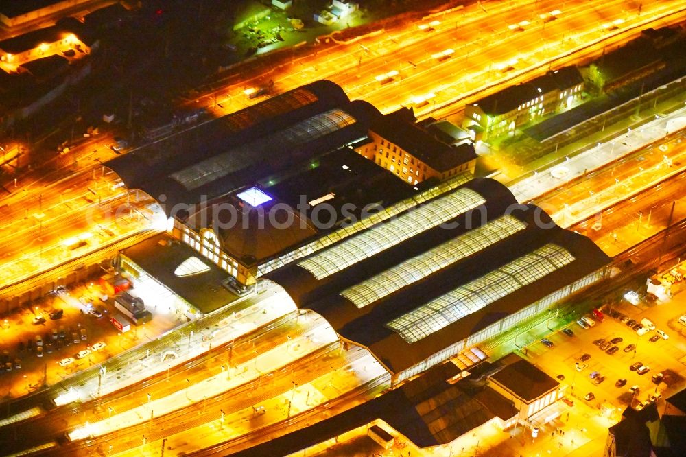 Aerial image at night Halle (Saale) - Night lighting Track progress and building of the main station of the railway in Halle (Saale) in the state Saxony-Anhalt, Germany