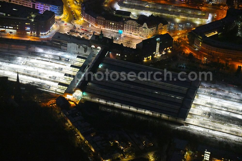 Aerial image at night Lübeck - Night lighting main station of the railway in the district Sankt Lorenz Sued in Luebeck in the state Schleswig-Holstein