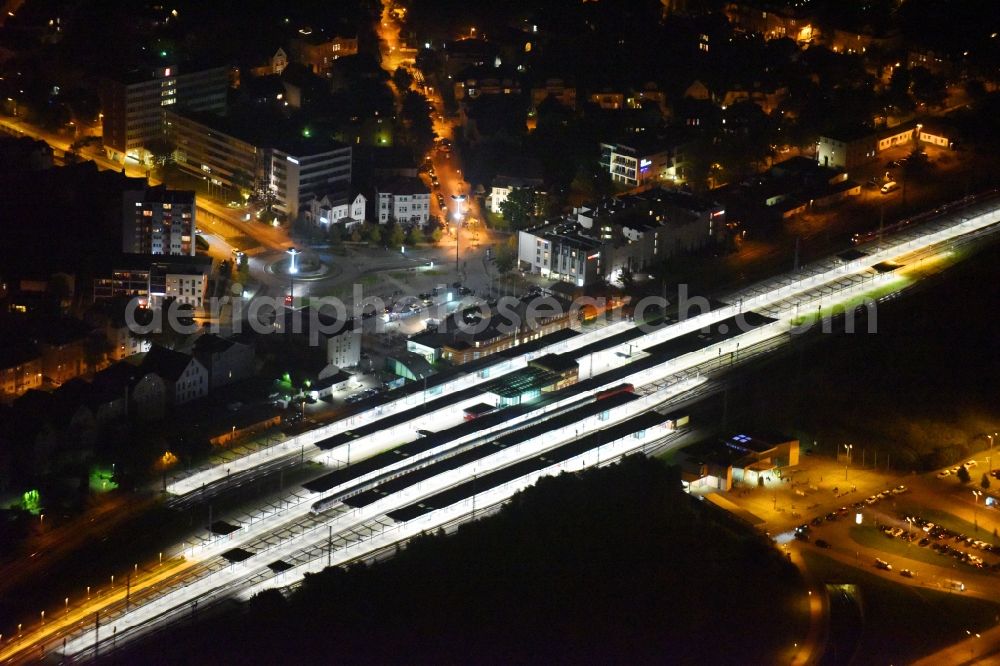 Aerial photograph at night Rostock - Night lighting Track progress and building of the main station of the railway in Rostock in the state Mecklenburg - Western Pomerania, Germany