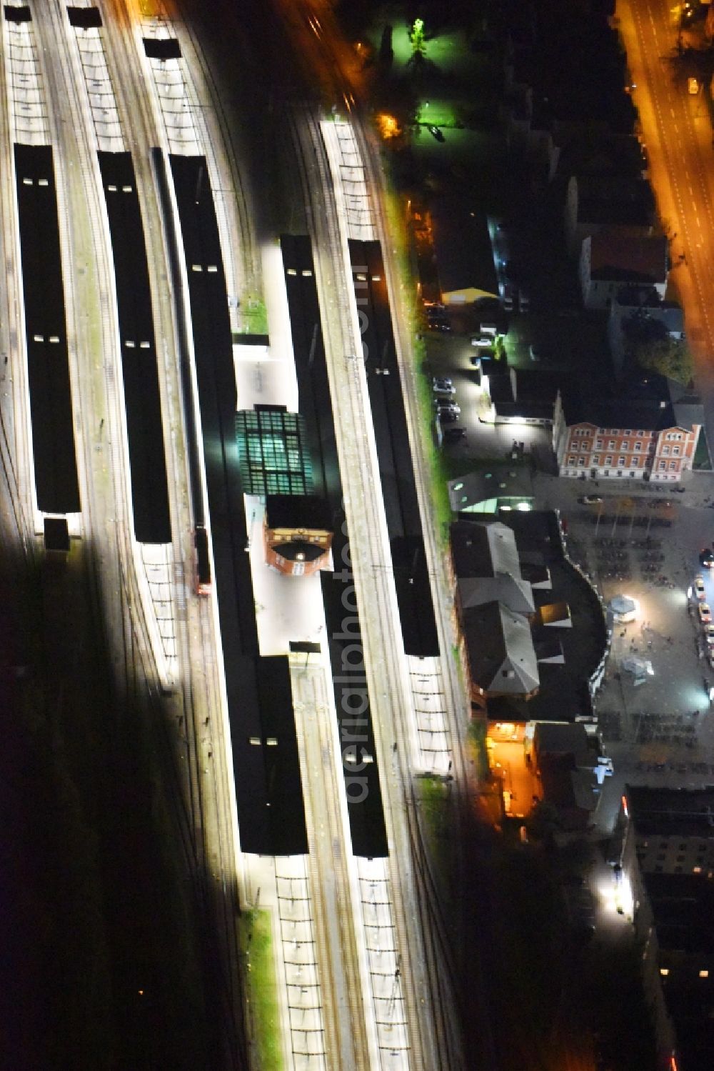 Aerial photograph at night Rostock - Night lighting Track progress and building of the main station of the railway in Rostock in the state Mecklenburg - Western Pomerania, Germany