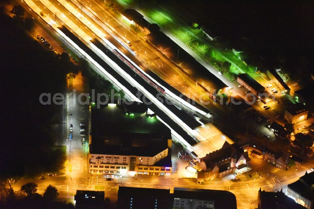 Aerial image at night Stralsund - Night lighting Track progress and building of the main station of the railway in Stralsund in the state Mecklenburg - Western Pomerania, Germany