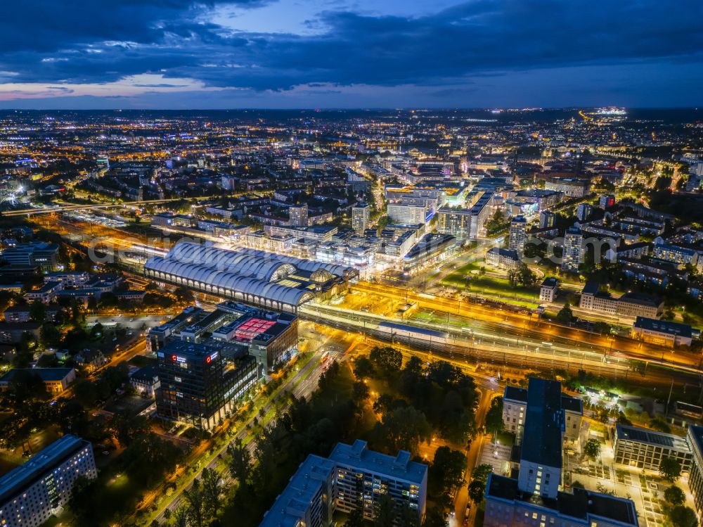 Aerial image at night Dresden - Night lighting track progress and building of the main station of the railway in Dresden in the state Saxony, Germany