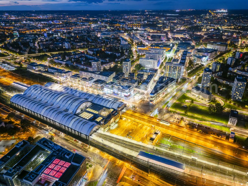 Dresden at night from the bird perspective: Night lighting track progress and building of the main station of the railway in Dresden in the state Saxony, Germany