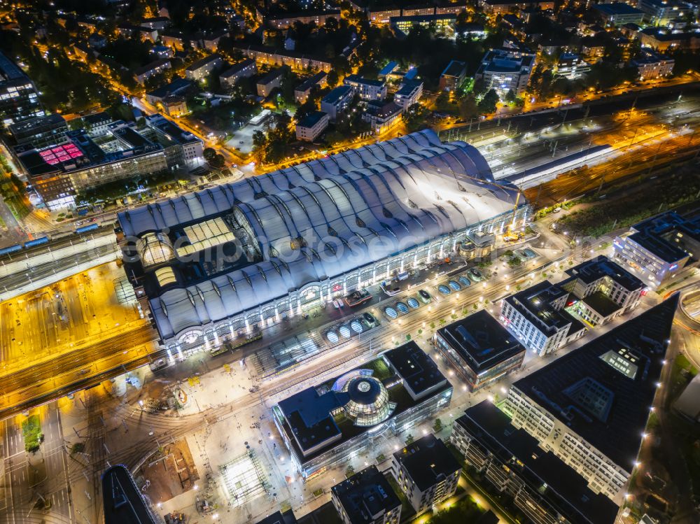 Aerial image at night Dresden - Night lighting track progress and building of the main station of the railway in Dresden in the state Saxony, Germany