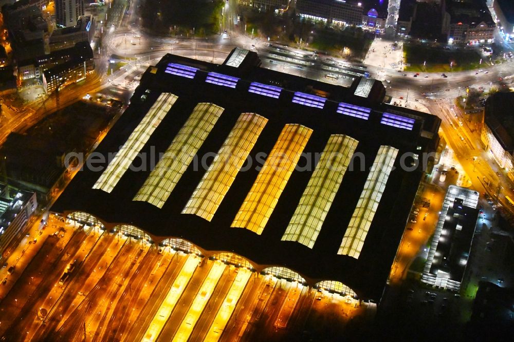 Aerial photograph at night Leipzig - Night lighting view over the building of the main station in Leipzig in Saxony