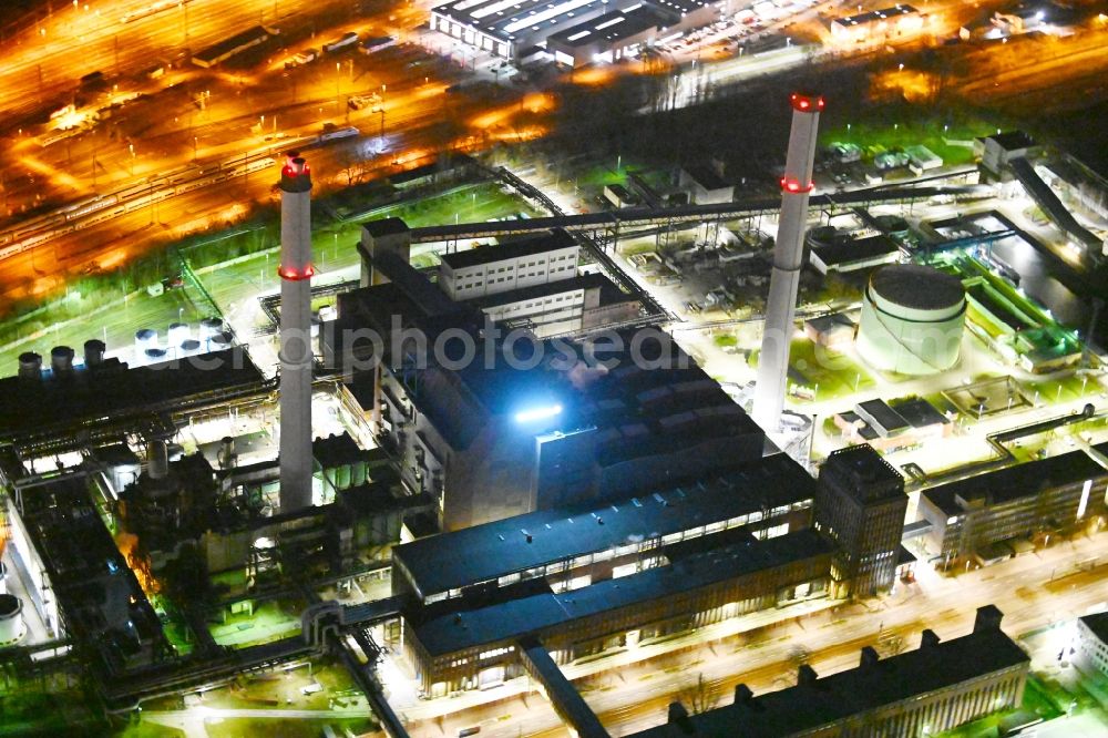 Berlin at night from the bird perspective: Night lighting combined heat and power station plant Klingenberg on Koepenicker Chaussee in Berlin-Rummelsburg