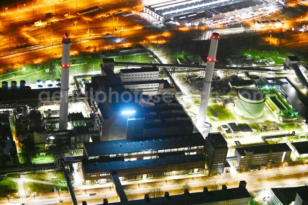 Aerial photograph at night Berlin - Night lighting combined heat and power station plant Klingenberg on Koepenicker Chaussee in Berlin-Rummelsburg