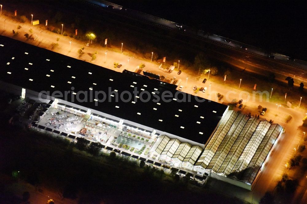 Hoppegarten at night from above - Night view Hellweg construction market at the Handwerkerstrasse in Hoppegarten in the state of Brandenburg