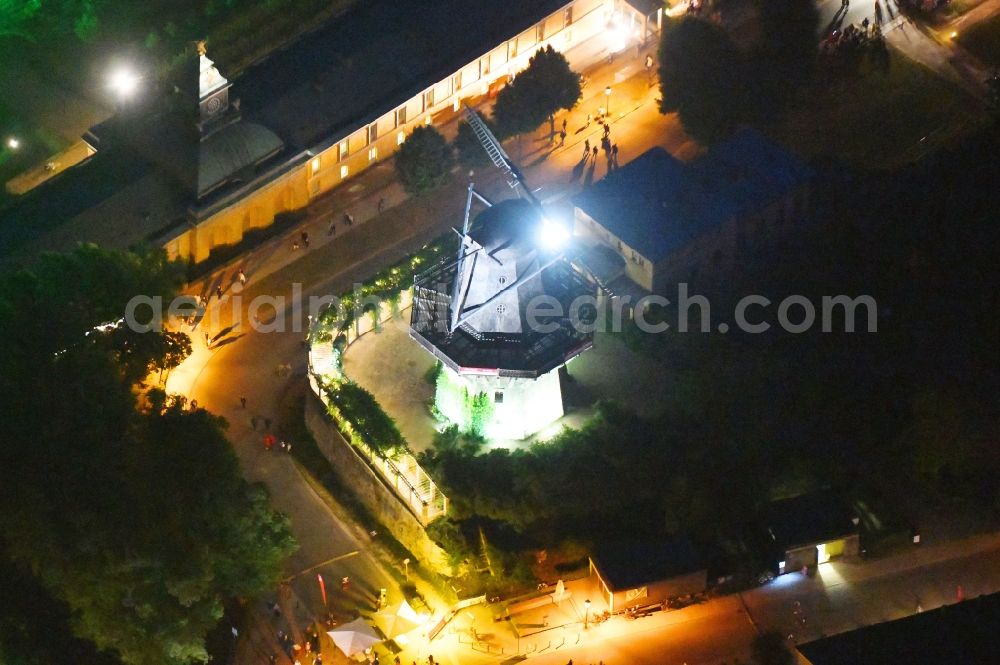 Aerial photograph at night Potsdam - Night lighting historic windmill on Maulbeerallee in Potsdam in the state Brandenburg, Germany