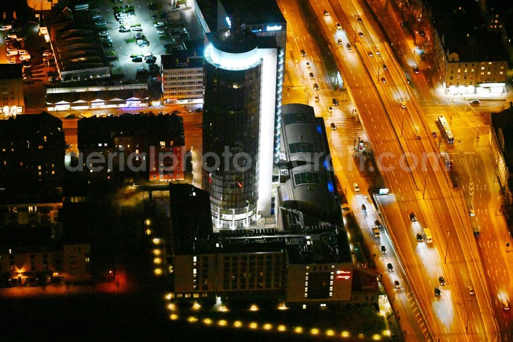 München at night from the bird perspective: Night lighting construction on Skyscraper Central Tower in Munich in Bavaria