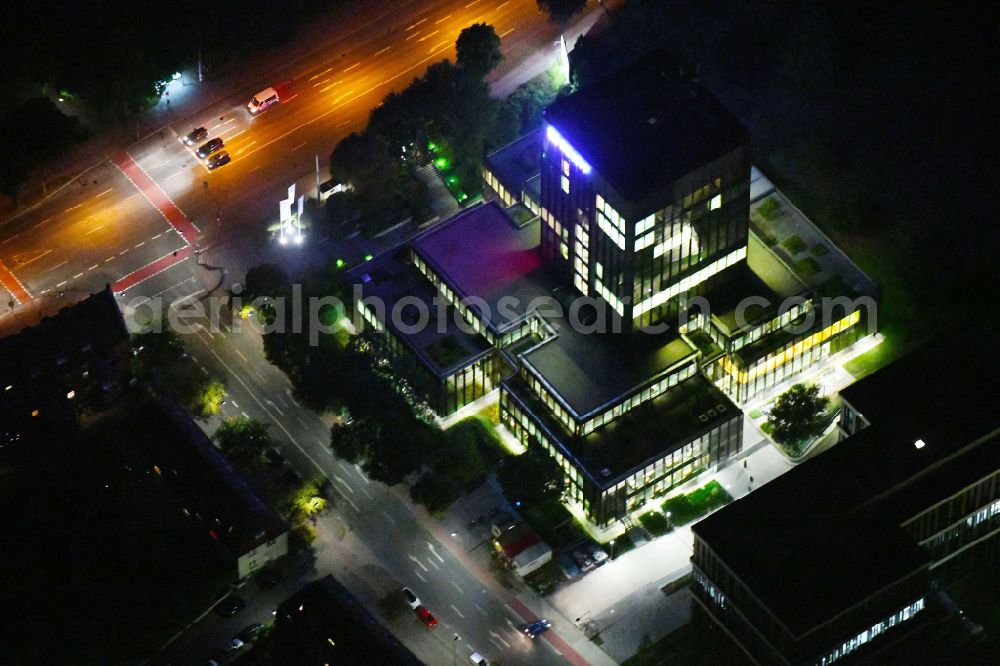 Aerial image at night Münster - Night lighting high-rise skyscraper building and bank administration of the financial services company on street Sentmaringer Weg in the district Geist in Muenster in the state North Rhine-Westphalia, Germany