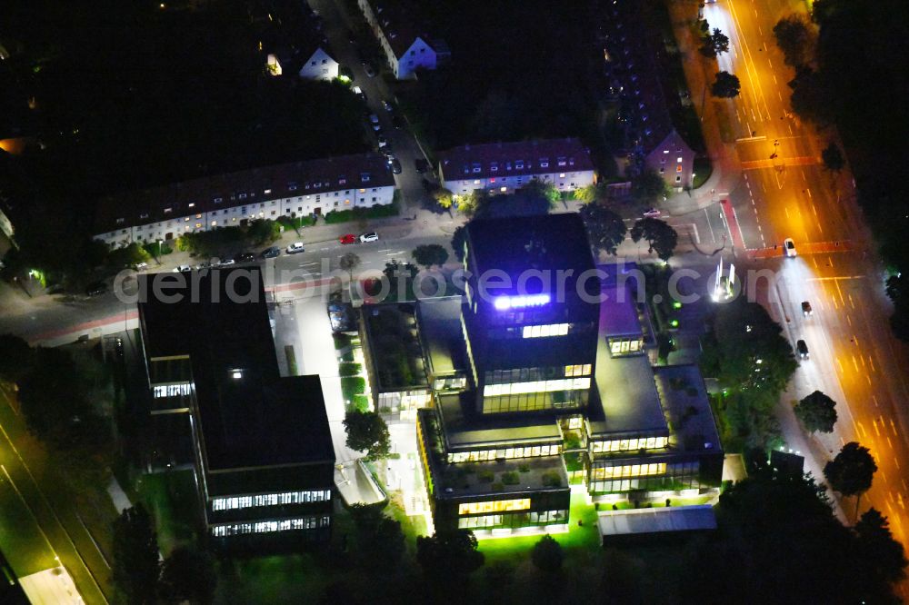 Aerial image at night Münster - Night lighting high-rise skyscraper building and bank administration of the financial services company on street Sentmaringer Weg in the district Geist in Muenster in the state North Rhine-Westphalia, Germany