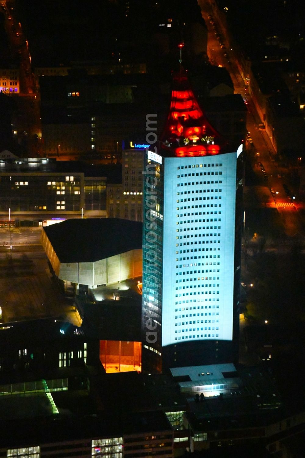 Aerial image at night Leipzig - Night lighting High-rise buildings City-Hochhaus in Leipzig in the state Saxony