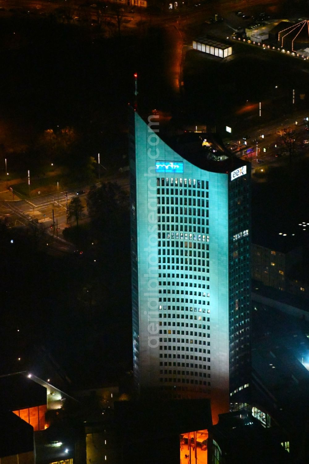 Leipzig at night from the bird perspective: Night lighting High-rise buildings City-Hochhaus in Leipzig in the state Saxony