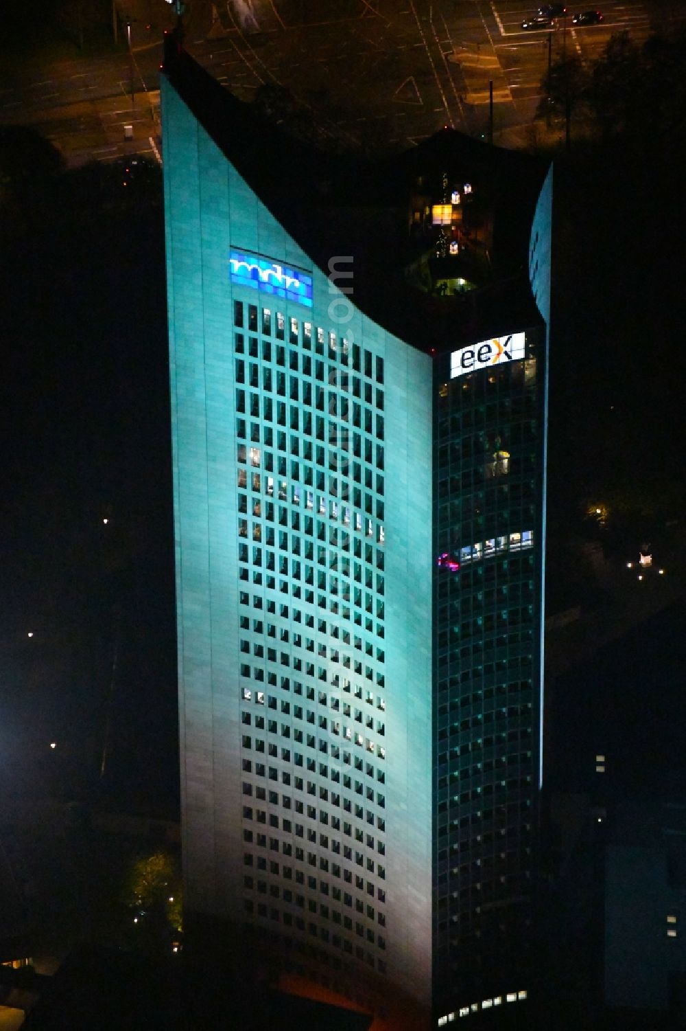 Aerial image at night Leipzig - Night lighting High-rise buildings City-Hochhaus in Leipzig in the state Saxony