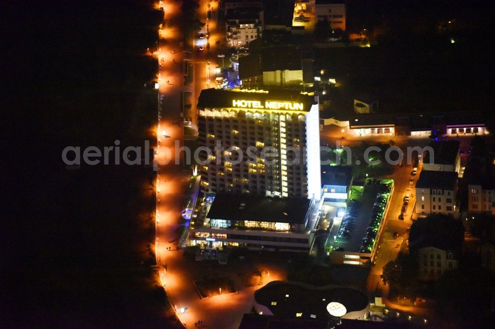 Rostock at night from the bird perspective: Night lighting High-rise building of the hotel complex Hotel NEPTUN on Seestrasse in Rostock in the state Mecklenburg - Western Pomerania, Germany