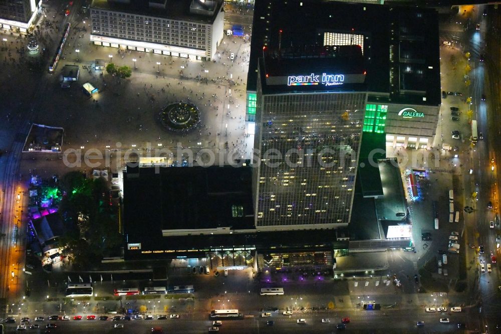 Berlin at night from above - Night lighting High-rise building of the hotel complex Park Inn by Radisson Berlin Alexanderplatz in the district Mitte in Berlin, Germany