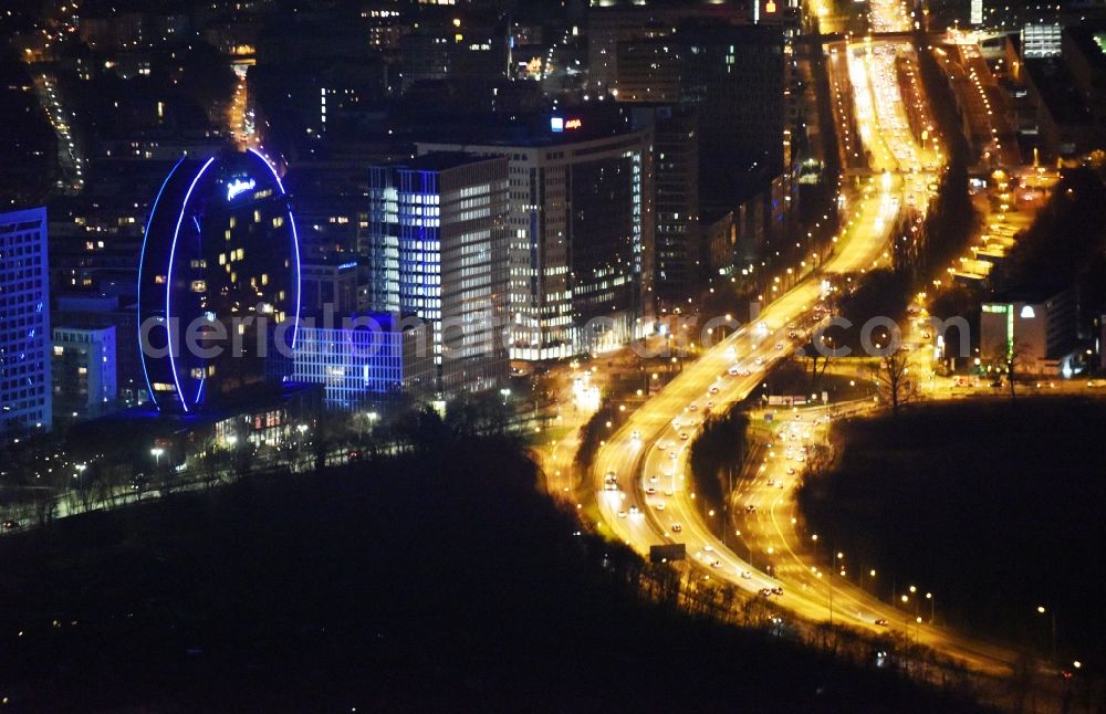 Aerial photograph at night Frankfurt am Main - Night view High-rise building of the hotel complex Radisson Blu Hotel an der Franklinstrasse in Frankfurt in the state Hesse