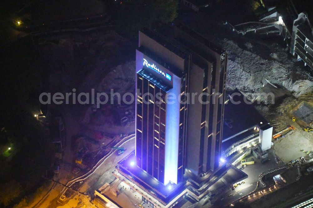 Aerial image at night Hamburg - Night lighting High-rise building of the hotel complex Radisson Blu on Marseiller Strasse in Hamburg, Germany