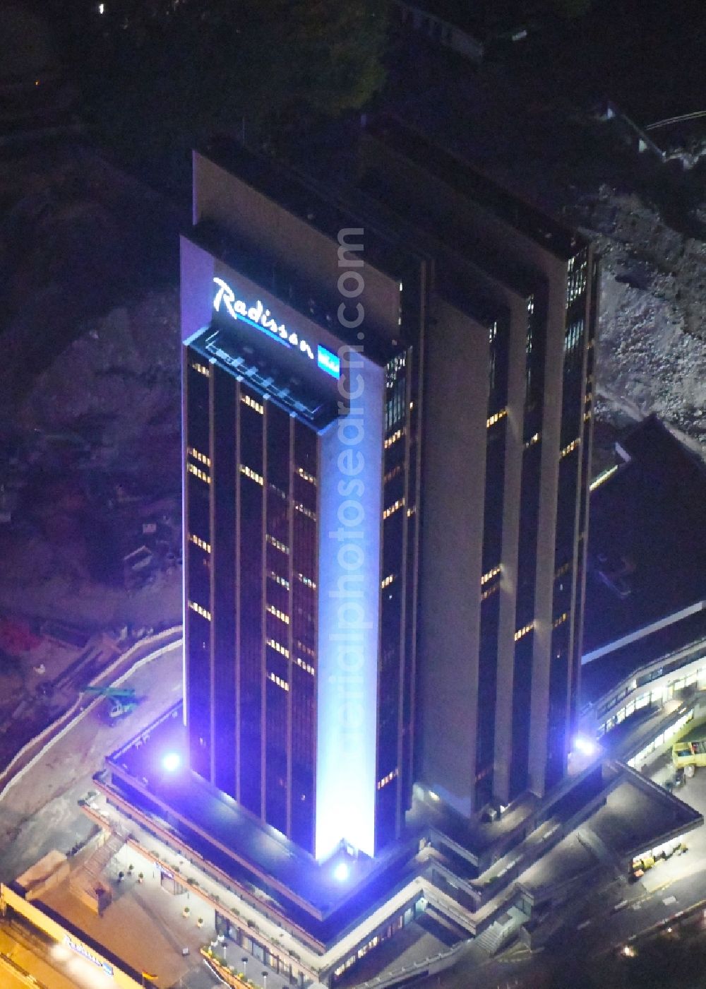 Hamburg at night from above - Night lighting High-rise building of the hotel complex Radisson Blu on Marseiller Strasse in Hamburg, Germany