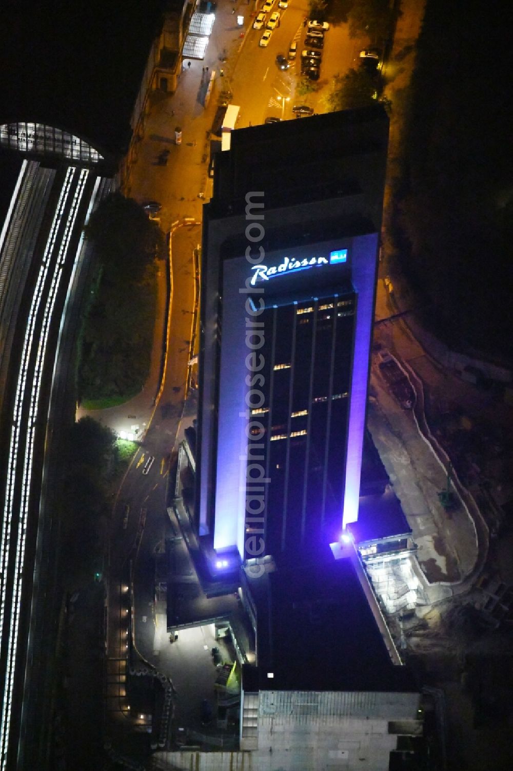 Aerial image at night Hamburg - Night lighting High-rise building of the hotel complex Radisson Blu on Marseiller Strasse in Hamburg, Germany