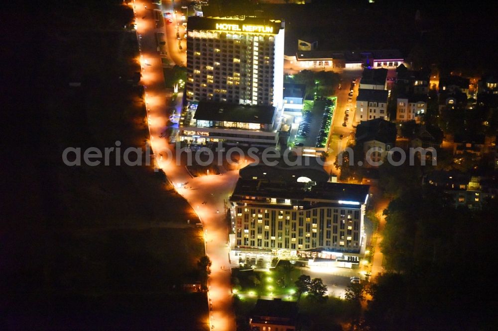 Rostock at night from above - Night lighting High-rise building of the hotel complex a-ja Warnemuende. Das Resort Zur Promenade in Rostock in the state Mecklenburg - Western Pomerania, Germany