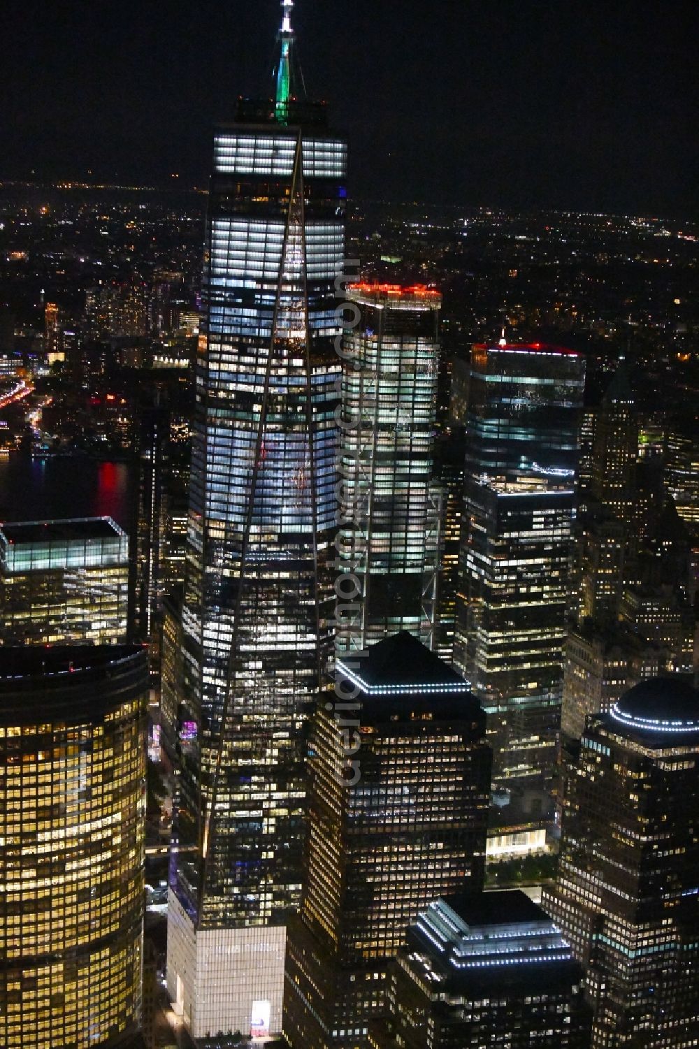 Aerial image at night New York - Night lighting High-rise buildings One World Trade Center in the district Manhattan in New York in United States of America