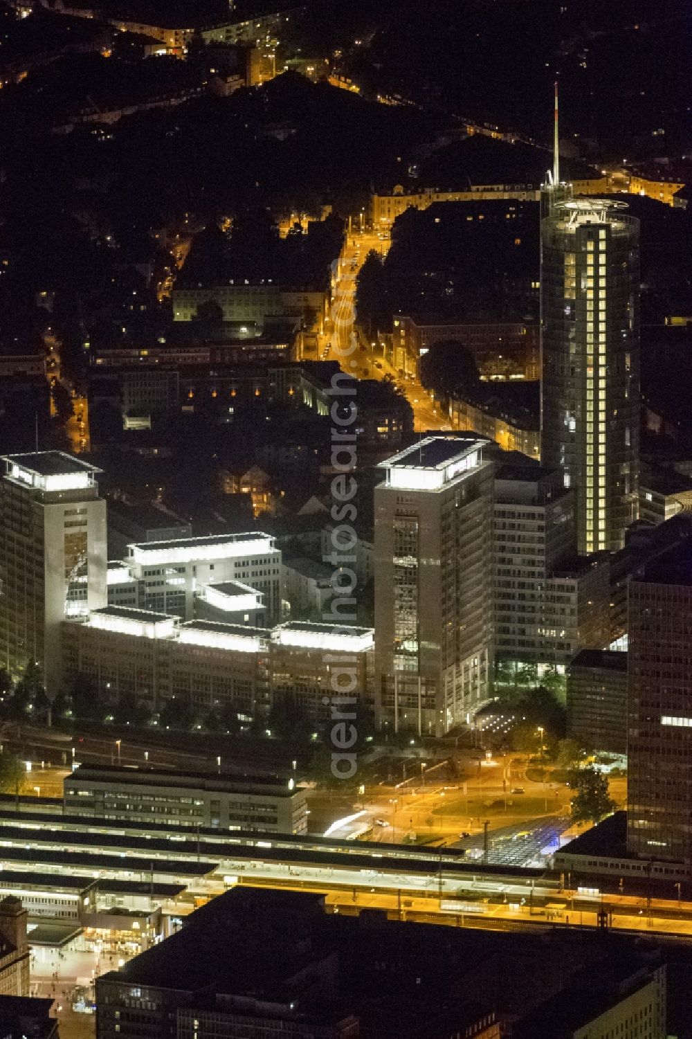 Aerial photograph at night Essen - View of the RWE headquarters in Essen at night. The RWE Tower is with 120 meters and up to 500 workplaces the headquarter of the energy supplier RWE. The tower is designed ecological and gains energy from natural daylight and solar heat