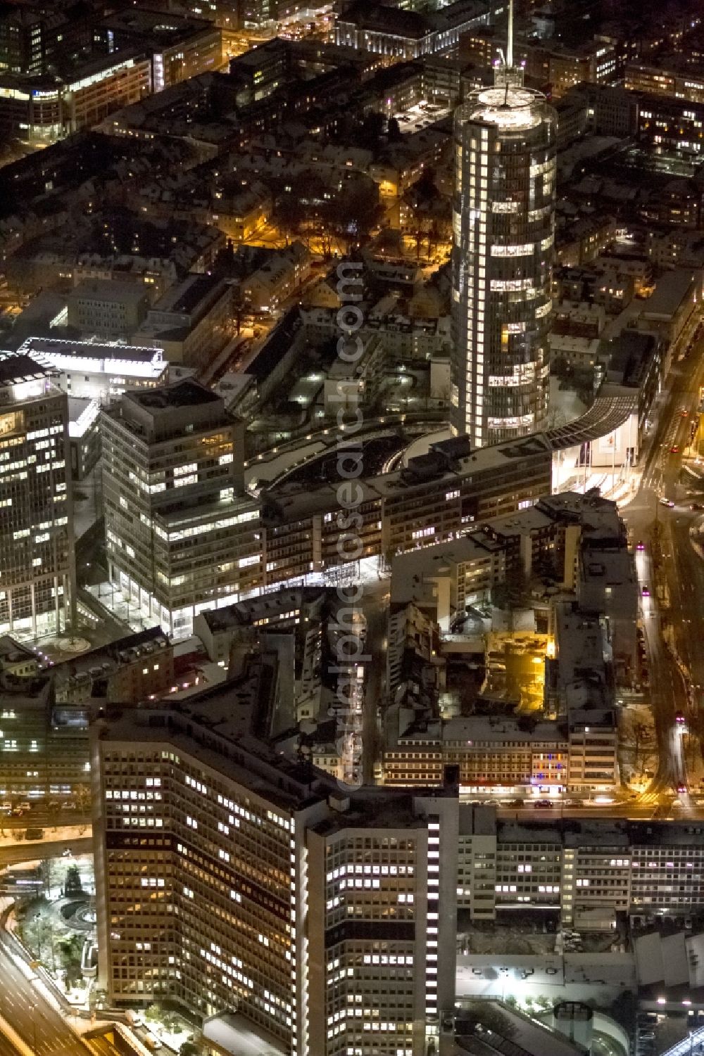 Aerial image at night Essen - View of the RWE headquarters in Essen at night. The RWE Tower is with 120 meters and up to 500 workplaces the headquarter of the energy supplier RWE. The tower is designed ecological and gains energy from natural daylight and solar heat