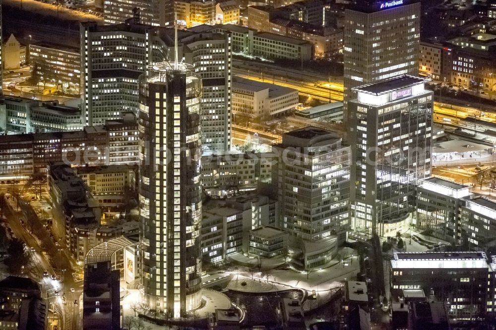 Aerial image at night Essen - View of the RWE headquarters in Essen at night. The RWE Tower is with 120 meters and up to 500 workplaces the headquarter of the energy supplier RWE. The tower is designed ecological and gains energy from natural daylight and solar heat