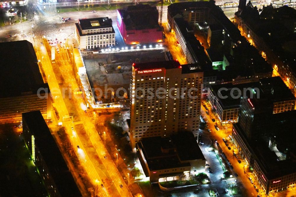 Aerial photograph at night Leipzig - Night lighting Complex of the hotel building high-rise The Westin Leipzig on Gerberstrasse in Leipzig in the state of Saxony