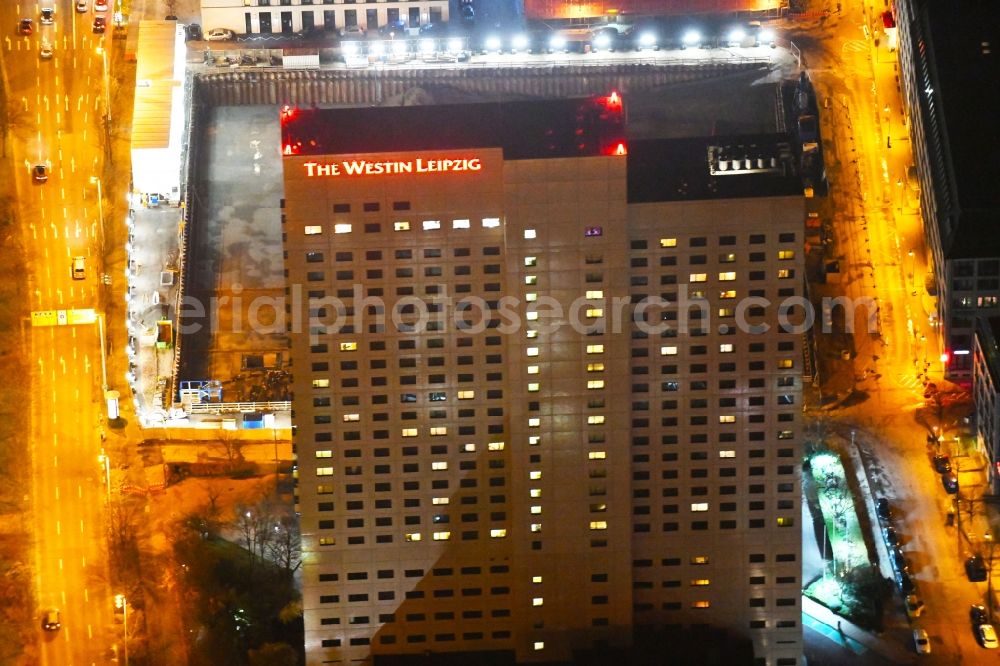 Leipzig at night from the bird perspective: Night lighting Complex of the hotel building high-rise The Westin Leipzig on Gerberstrasse in Leipzig in the state of Saxony