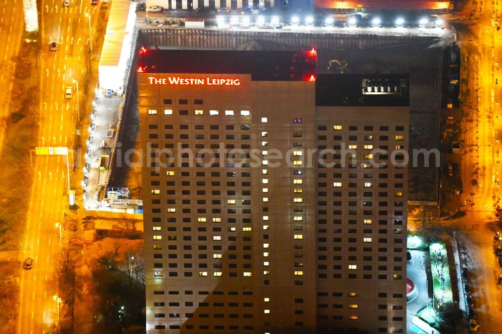 Aerial photograph at night Leipzig - Night lighting Complex of the hotel building high-rise The Westin Leipzig on Gerberstrasse in Leipzig in the state of Saxony