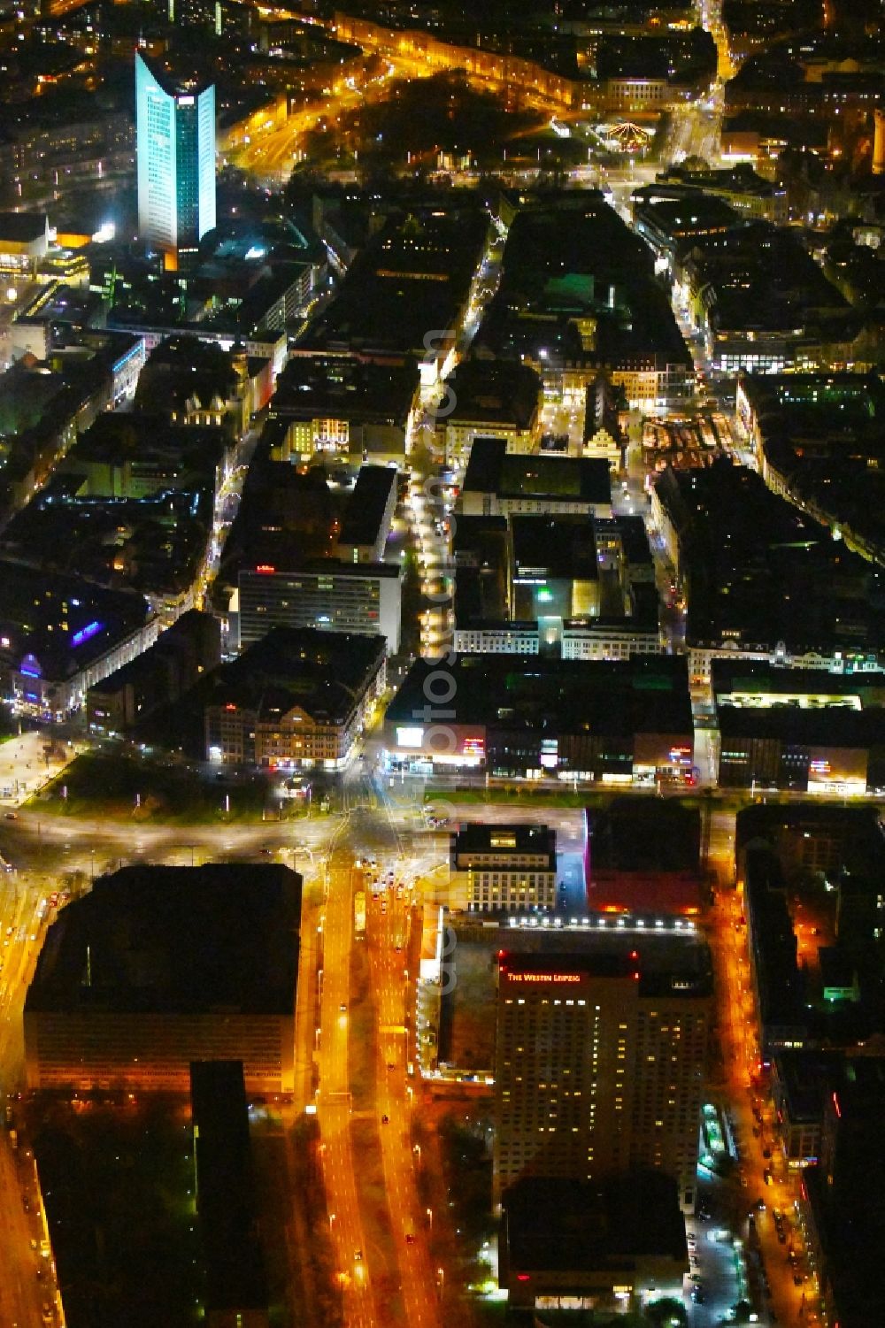 Aerial image at night Leipzig - Night lighting Complex of the hotel building high-rise The Westin Leipzig on Gerberstrasse in Leipzig in the state of Saxony